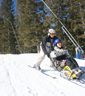 teacher helping a student ski