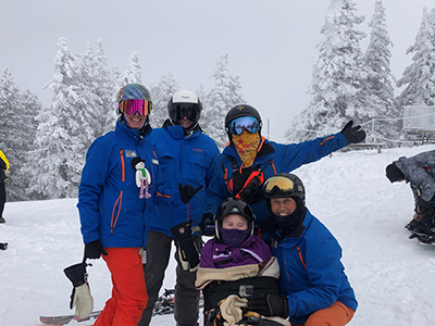 Makenzie and family skiing