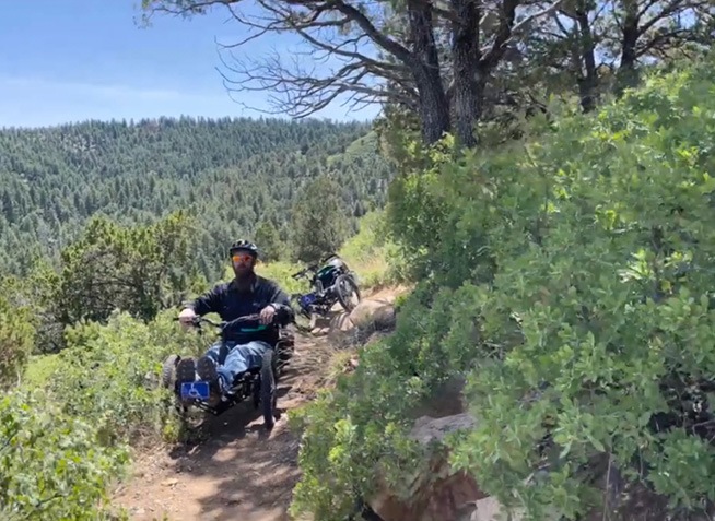 Adaptive bikes riding along a trail